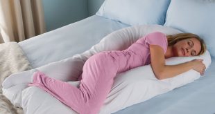 woman sleeping on body pillow
