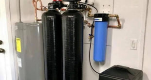 whole house water softener canisters mounted on wall