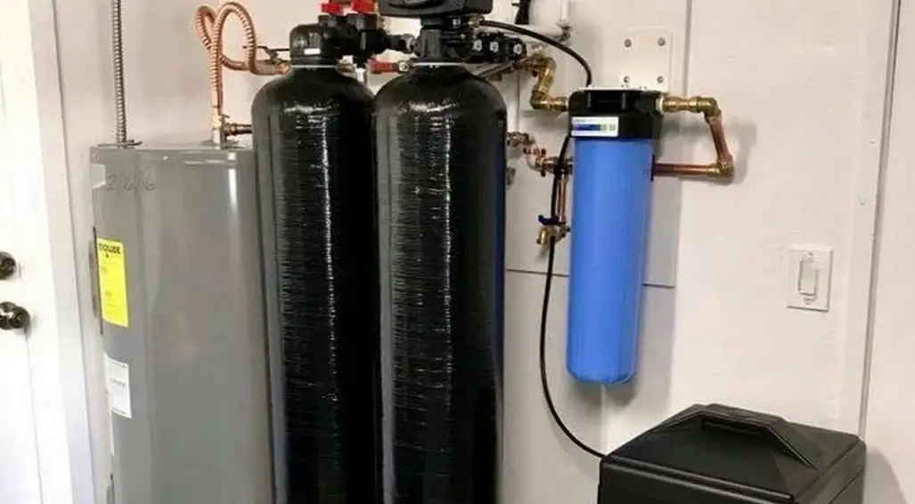 whole house water softener canisters mounted on wall