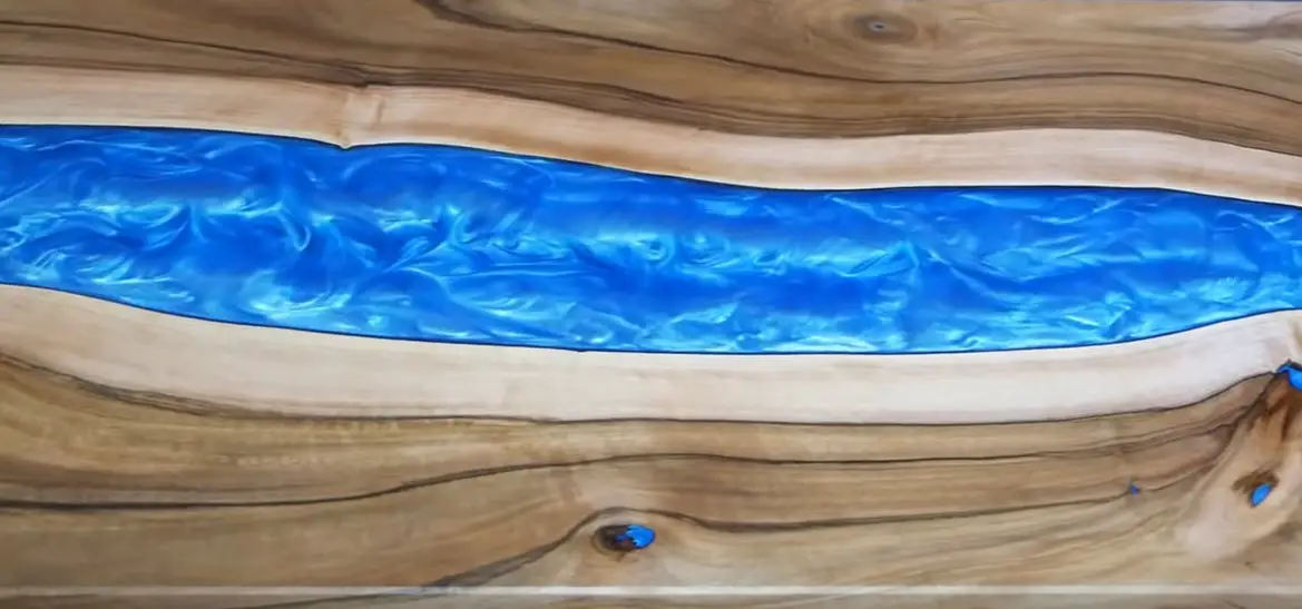 finished blue epoxy resin river table