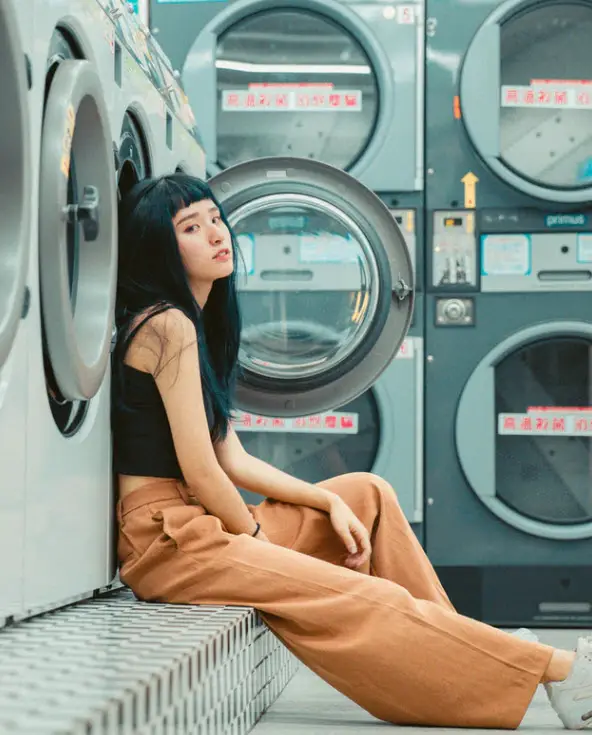 girl waiting for laundry