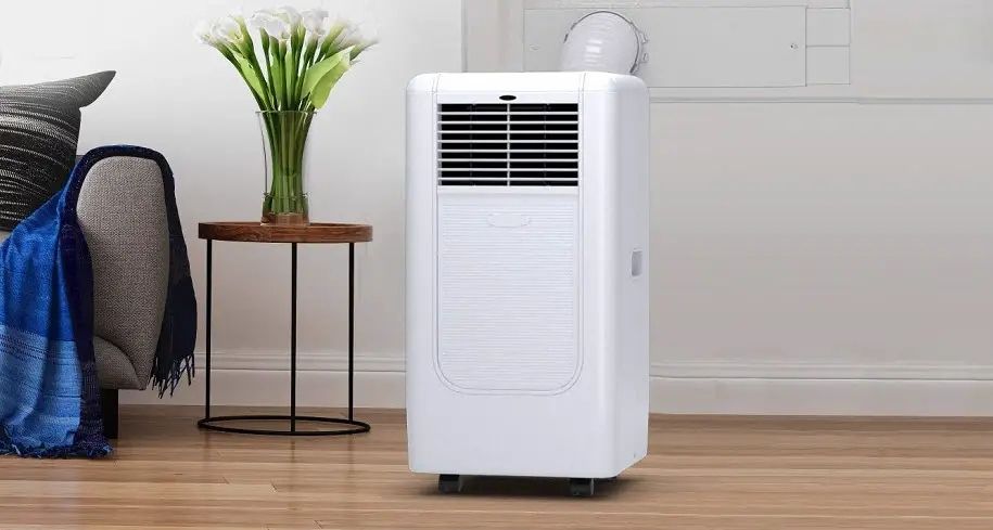 portable air conditioner sitting on the floor in room